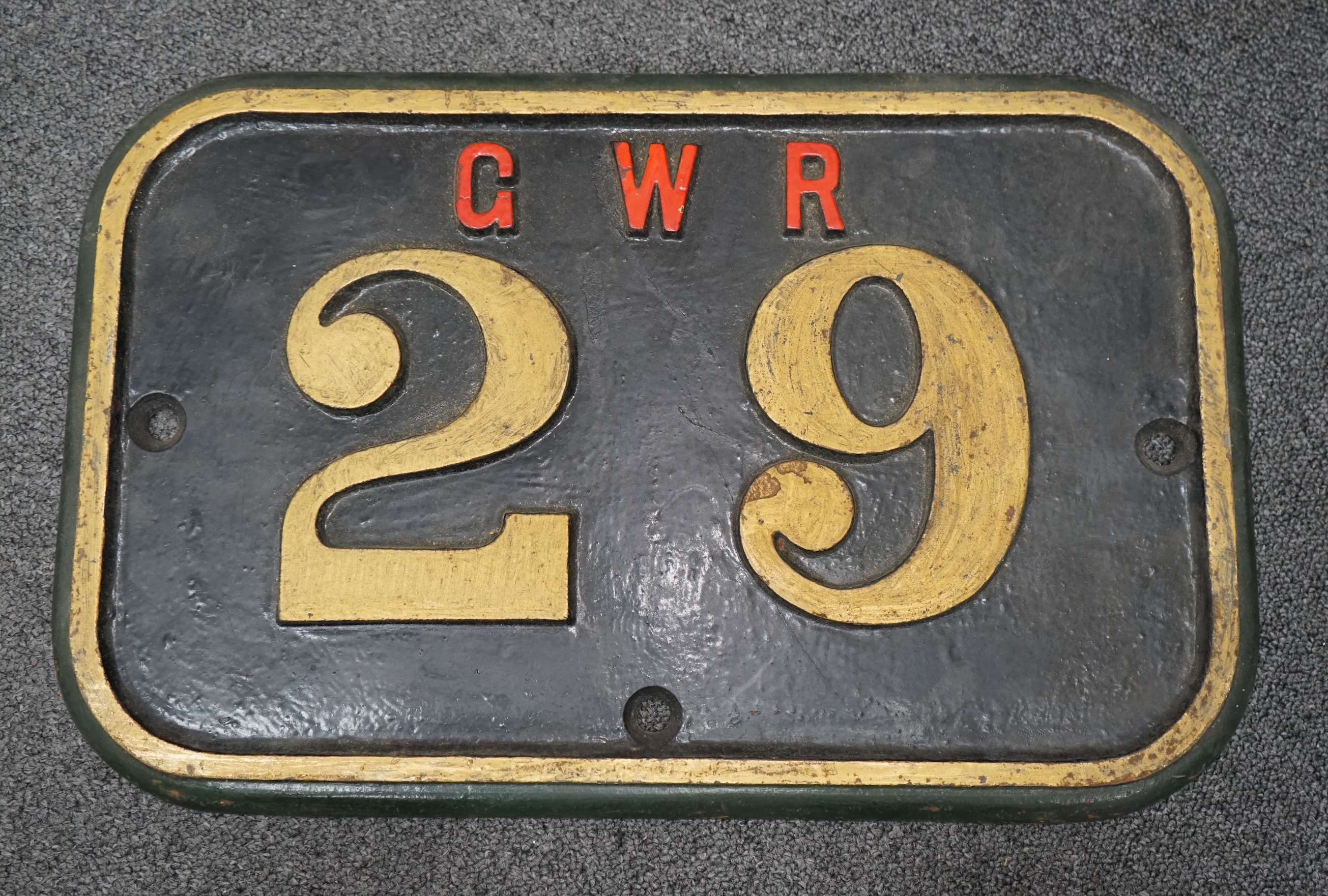 A cast iron GWR locomotive cab side number plate for an 0-6-0ST locomotive, 29, later converted to a pannier tank in the 1920s and used by the Hafod Colliery Railway, dimensions; 46.5cm x 29.5cm. Condition - fair to good